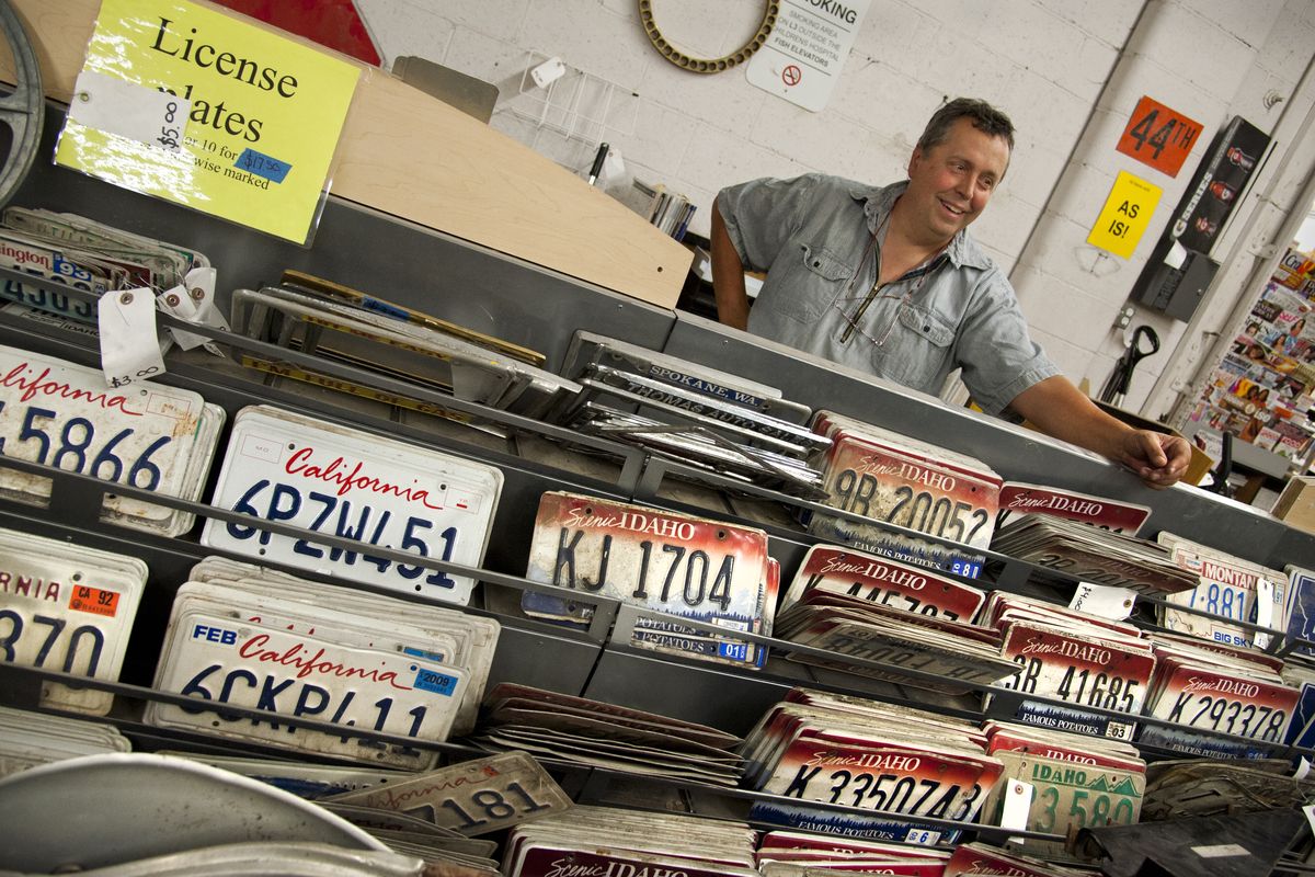 Jim Schrock of Earthworks Recycling has hundreds of license plates for sale in his warehouse building. (Dan Pelle)