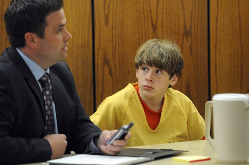 ORG XMIT: IDNCP103 Zachary Neagle, 14, looks on at his attorney as he speaks to the judge about setting a bond at the Canyon County Courthouse in Caldwell, Idaho Wednesday afternoon May 20, 2009. Neagle was arrested and charged with first degree murder earlier this week after his father, 33-year-old Jason Neagle of Caldwell, Idaho was found dead in his home Saturday. (AP Photo/Idaho Press-Tribune, Mike Vogt) (Mike Vogt / The Spokesman-Review)