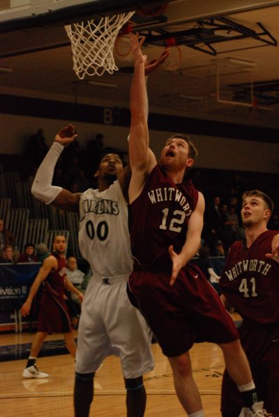 Whitworth’s Wade Gebbers, center, vies for the ball.
