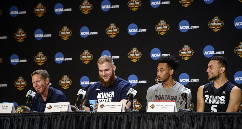 Gonzaga coach Mark Few, left, and players Przemek Karnowski, Johathan Williams and Nigel Williams-Goss keep things light at at a press conference, Sunday, April 2, in Phoenix. GU officials say a media tracking company estimates that the value of the Bulldogs run toward the championship totaled more than $400 million in broadcast and online exposure. (Dan Pelle / The Spokesman-Review)