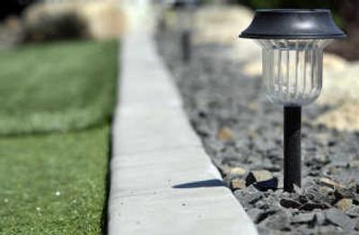 
Solar lights line the green and the steps up to the house.
 (The Spokesman-Review)