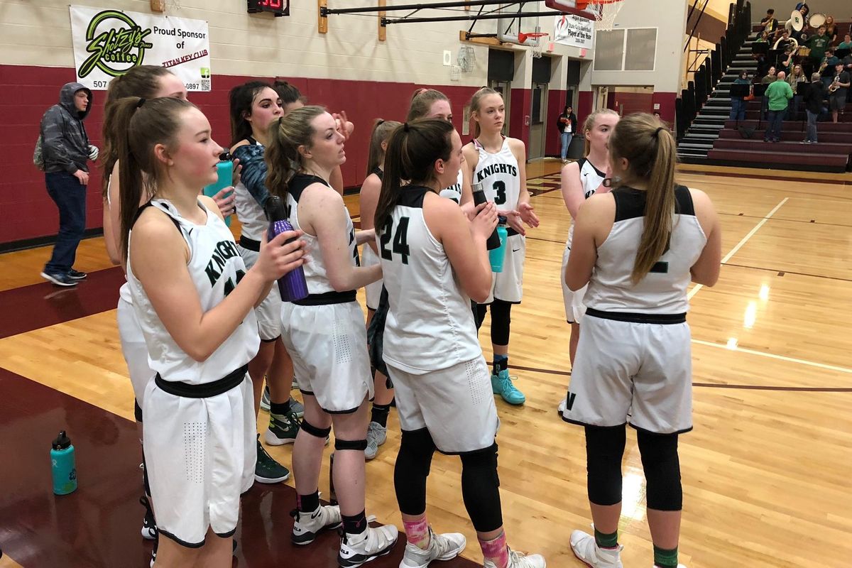 East Valley’s No. 1-rated girls team celebrates its 75-62 win over White River in a 2A regional at University HS on Saturday, Feb. 24, 2018. (Dave Nichols / The Spokesman-Review)