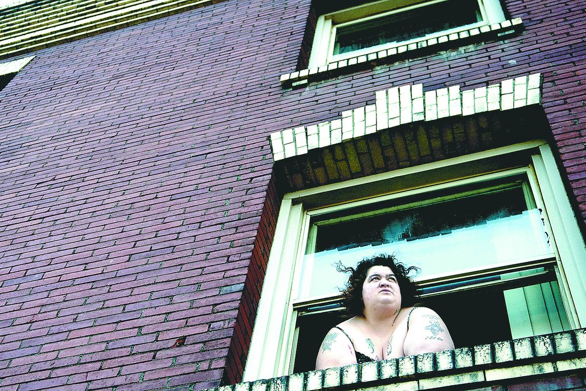 “I was homeless,” said Kayletta Thomas, looking out her window at the Collins Apartments in Spokane on March 30. The Housing First project is funded by the city to help the chronically homeless. It has 21 units, with a program manager on-site and other staffers to help its tenants get housing assistance, addiction treatment and mental health care. (Kathy Plonka)