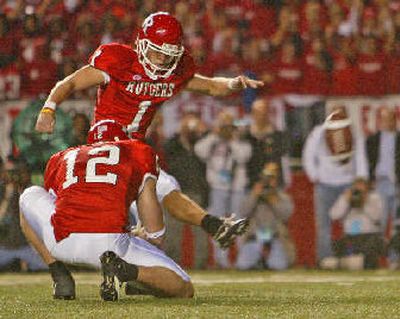 
Jeremy Ito kicks the game-winning field goal against Louisville. 
 (Associated Press / The Spokesman-Review)