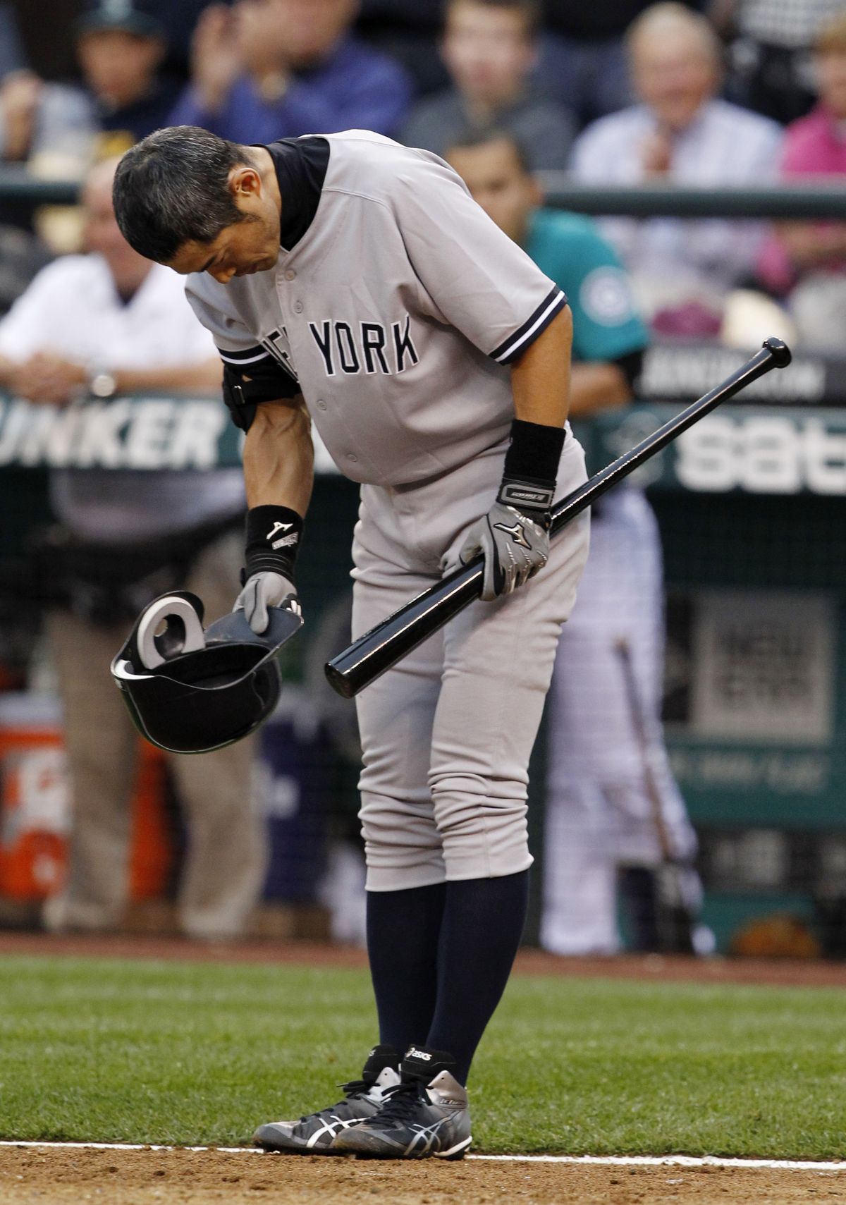Ichiro Suzuki bows to Safeco Field fans before his first at-bat for the Yankees. (Associated Press)