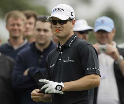 
Defending Masters' champion Zach Johnson examines the eighth fairway during a practice round Monday. Associated Press
 (Associated Press / The Spokesman-Review)