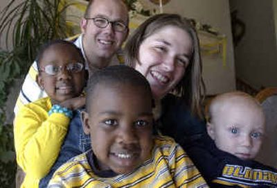 
Michael (back) and Ronica, second from right, Bishop have adopted Emily Odine, 6, left, and Michael Odelin, 4 (front) who are siblings from Haiti, at right is their little brother John, 1. Michael (back) and Ronica, second from right, Bishop have adopted Emily Odine, 6, left, and Michael Odelin, 4 (front) who are siblings from Haiti, at right is their little brother John, 1. 
 (Jesse Tinsley/Jesse Tinsley/ / The Spokesman-Review)