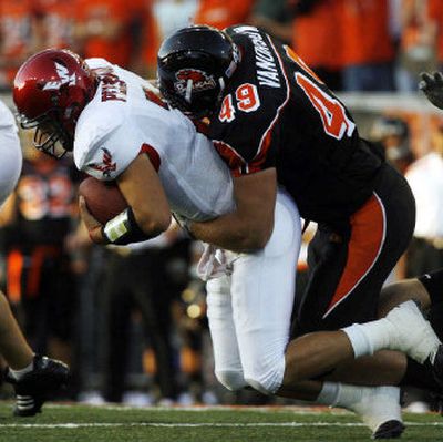 
Oregon State's Jeff Van Orsow sacks Eastern Washington quarterback Chris Peerboom during the first quarter Thursday. 
 (Associated Press / The Spokesman-Review)