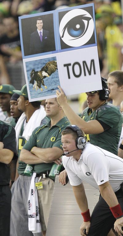 Oregon’s whimsical play-calling signs are efficient and popular with fans.  (Associated Press)