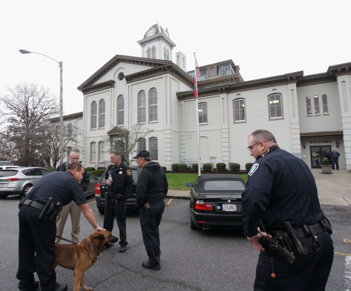 Morristown Police prepare to sweep the Hamblen County Courthouse Tuesday Nov. 27, 2012 in Morristown, Tenn.  Bomb threats forced the evacuation of 24 courthouses across Tennessee Tuesday morning, including the federal building in Memphis, but authorities who are investigating said no devices were found. (Aletheia Davidson / The Citizen Tribune)