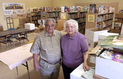 
John Frucci and his wife, Jean, keep track of and organize  books at The Children's Book Bank at the old University High School. The book bank is sponsored by  area Kiwanis Clubs and Sucess by Six. It provides books to any child up to age 6, and works with parents to encourage reading.  
 (J. BART RAYNIAK / The Spokesman-Review)