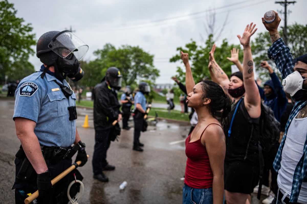 FILE - Protesters and police face each other during a rally for George Floyd in Minneapolis on May 26, 2020. Almost two years after George Floyd died at the hands of four Minneapolis police officers, Minnesota