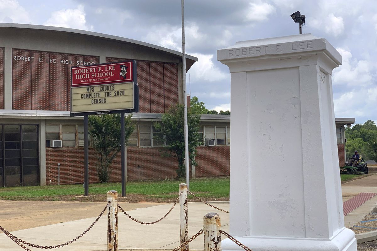 A pedestal that held a statue of Robert E. Lee stands empty outside a high school named for the Confederate general in Montgomery, Ala. on Tuesday, June 2, 2020. Four people were charged with criminal mischief after someone removed the statue amid nationwide protests over the police killing of George Floyd in Minnesota. (Kim Chandler)