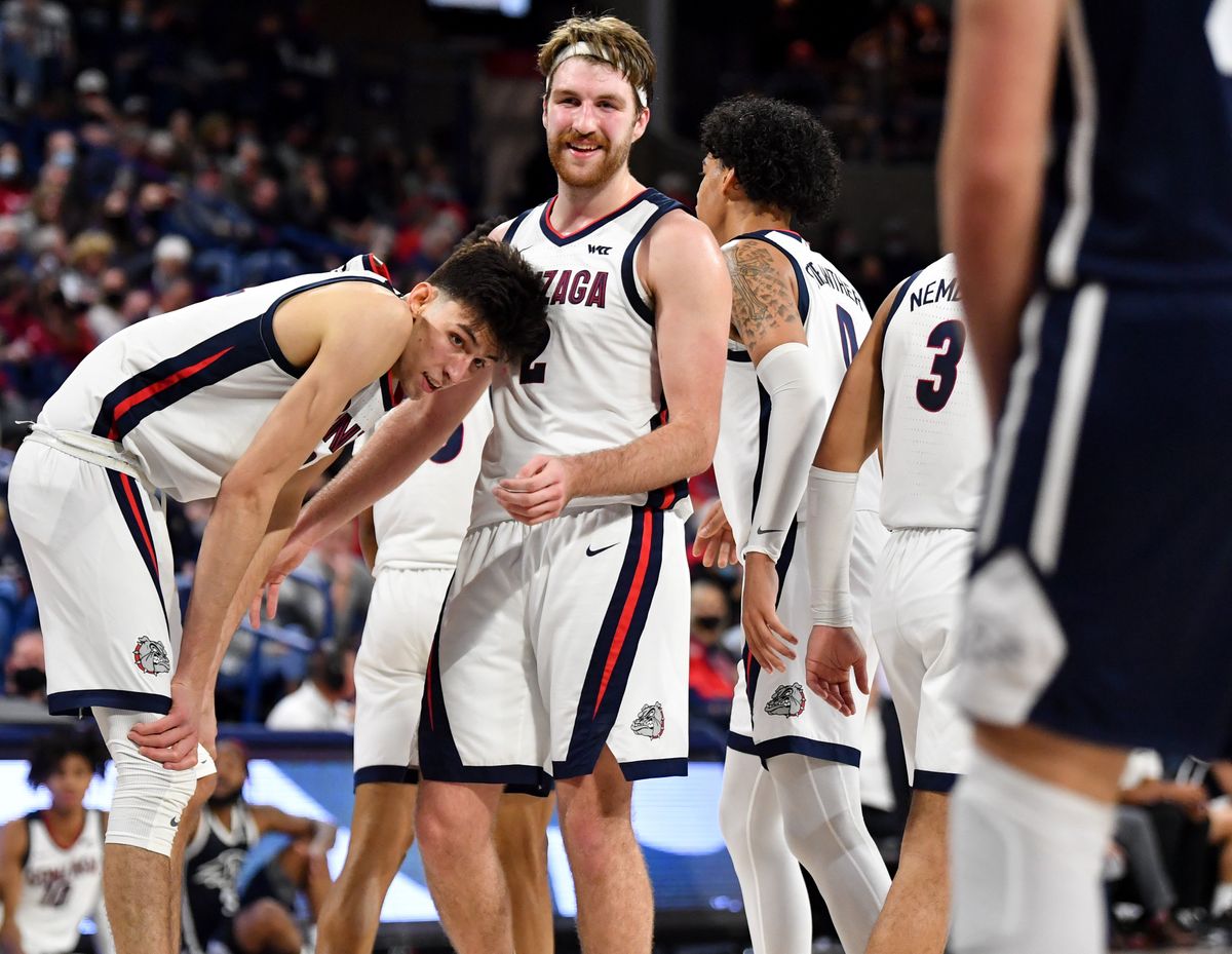 Gonzaga Bulldogs forward Drew Timme (2) and center Chet Holmgren (34) chat between plays during the second half of a college basketball game on Tuesday, Nov 9, 2021, at McCarthey Athletic Center in Spokane, Wash. Gonzaga won the game 97-63.  (Tyler Tjomsland / The Spokesman-Review)