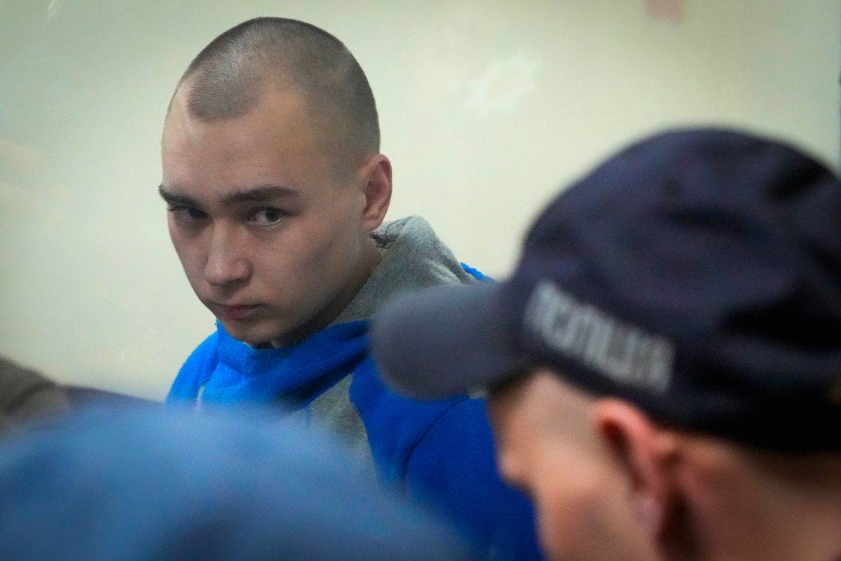 Russian army Sergeant Vadim Shishimarin, 21, is seen behind a glass during a court hearing in Kyiv, Ukraine, Wednesday, May 18, 2022. The Russian soldier has gone on trial in Ukraine for the killing of an unarmed civilian. The case that opened in Kyiv marked the first time a member of the Russian military has been prosecuted for a war crime since Russia invaded Ukraine 11 weeks ago.  (Efrem Lukatsky)