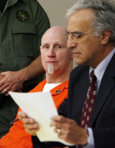 Convicted murderer Ronnie Lee Gardner, center, sits with his lawyer Andrew Parnes in court Salt Lake City on Friday.  (Associated Press)