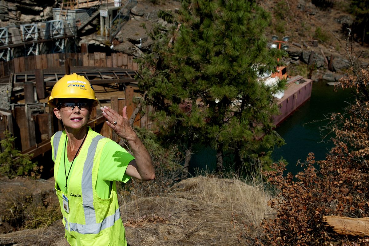 Project manager Mary Jensen of Avista answers a question during a tour of a cofferdam at Post Falls Dam on Monday. (Kathy Plonka)