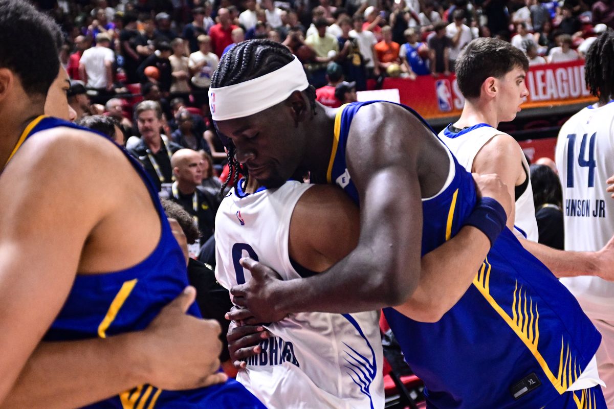 Golden State Warriors forward Graham Ike (45) embraces fromer Gonzaga teammate Dallas Mavericks guard Ryan Nembhard (9) after a Summer League matchup on Thursday, Jul 9, 2026, at the Thomas & Mack Center in Las Vegas, Nev. The Warriors won the game 101-90. (Tyler Tjomsland / The Spokesman-Review)