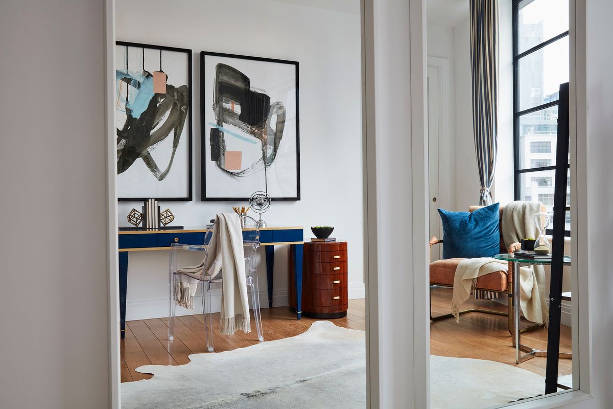 A small office is made to feel open and bright through the use of mirrors.  (Scott Gabriel Morris/HOBBS/TNS)