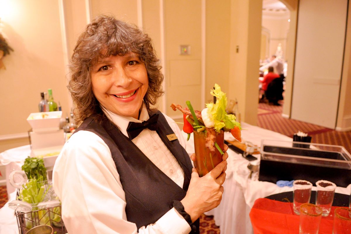 Terrie J. Cramer serves bloody marys at the Historic Davenport Hotel during a recent Sunday brunch. (Adriana Janovich / The Spokesman-Review)