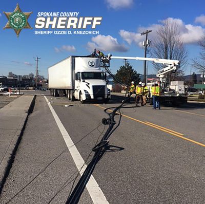 Spokane County sheriff’s deputies and a crew from Avista Utilities responded after a semitruck hit a sagging power line on Montgomery Drive in Spokane Valley on Monday, Feb. 10, 2020. (Spokane County Sheriff’s Office)