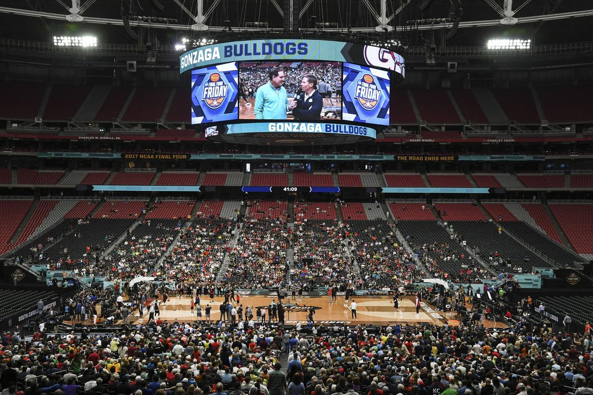 Gonzaga coach Mark Few is interviewed by CBS broadcaster Jim Nantz and shown on the big screen during practice, March 31, 2017, at the University of Phoenix Stadium. (Dan Pelle / The Spokesman-Review)