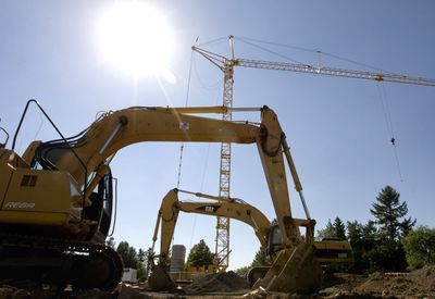 In this file photo construction equipment  waits to continue laying the foundation for  a new dorm at WSU. File The Spokesman Review (TYLER TJOMSLAND The Spokesman Review / The Spokesman-Review)