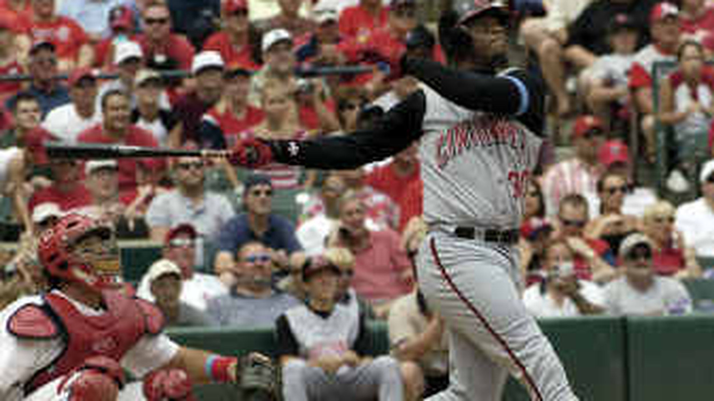 Cincinnati Reds Ken Griffey, Jr. warms up in right field in the