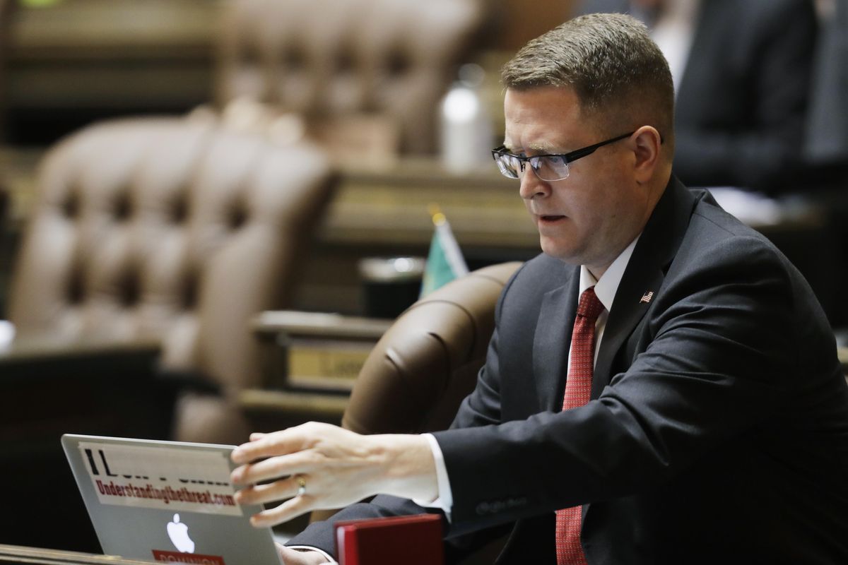 Washington State Rep. Matt Shea, R-Spokane Valley, adjusts his laptop computer on the floor of the House, Monday, April 22, 2019, at the Capitol in Olympia. (Ted S. Warren / AP)