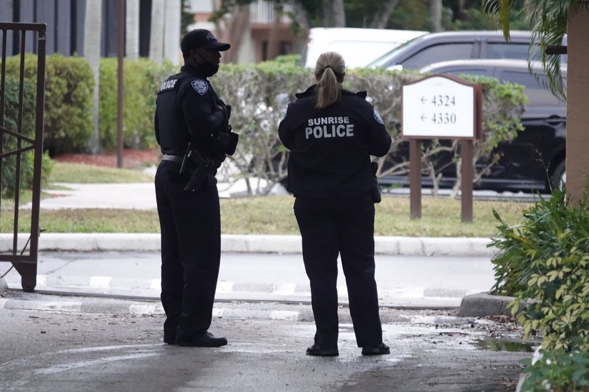 Police officers work near the scene of a shooting that wounded several FBI agents in Sunrise, Fla., Tuesday, Feb. 2, 2021.  (Joe Cavaretta)