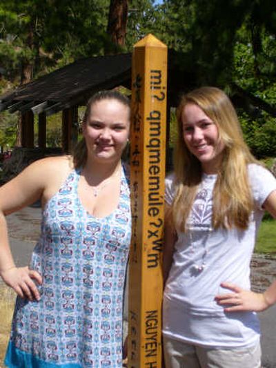
Aimee Goold, left, and Amanda Edens stand next to a Peace Pole in Mirabeau Park that was erected as part of the girl's Girl Scout Gold Award Project. Courtesy of Aimee Goold
 (Courtesy of Aimee Goold / The Spokesman-Review)