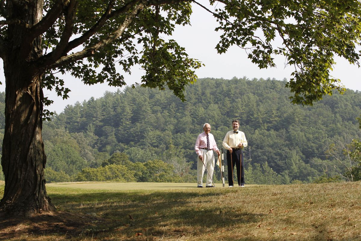 Owner Lewis Keller Sr., left, and Bill Sharp walk on the ninth hole at Oakhurst Links, one of the nation’s first golf courses. (Associated Press)