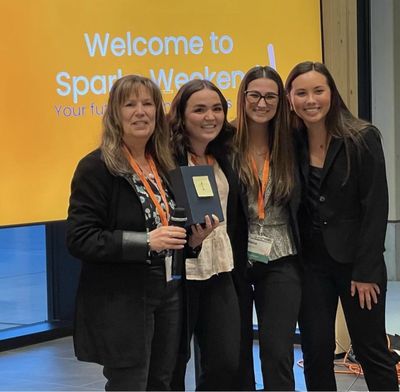 Entrepreneur Lisa Shaffer poses with Gonzaga University students Kate Sprague, Siena Merrin and Hayley Mosby. The three students recently won first place at Sparks Weekend.  (Courtesy photo)