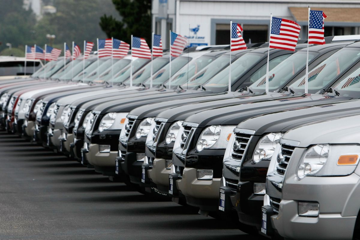 A row of new Ford trucks are displayed on display at a Ford dealership Sept. 4, 2007, in Colma, California. Ford Motor reported a 14 percent decline in August sales of cars and trucks in the U.S. on August 4 as fuel prices continue to rise and the housing market weakens.   (Justin Sullivan/Getty Images North America/TNS)