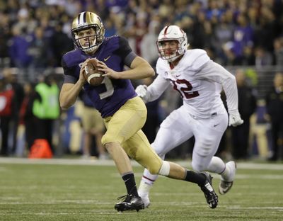 Washington quarterback Jake Browning threw three touchdown passes to lead a romp past Stanford on Friday. (Ted S. Warren / Associated Press)