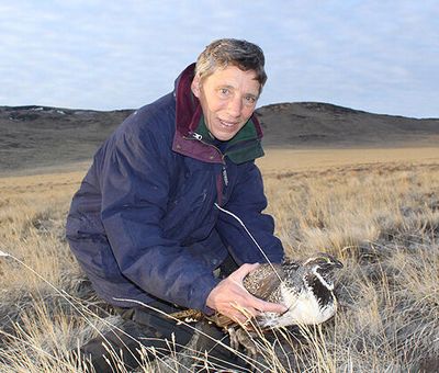 Kim Thorburn releases a grouse in Eastern Washington. Thorburn will speak at a Spokane Audubon Society meeting Nov. 11 about the fire destruction at the Swanson Lakes Wildlife Area.  (Courtesy)