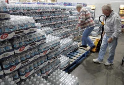 
Pallets of bottled water await purchase at Costco. Sales of the product have slowed as the nation's economic concerns mount. Associated Press
 (File Associated Press / The Spokesman-Review)