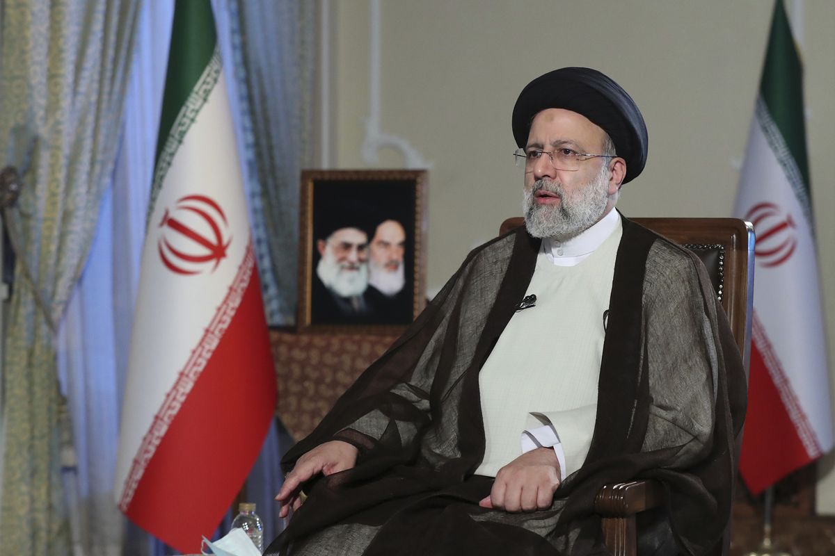 In this photo released by the office of the Iranian Presidency, President Ebrahim Raisi speaks during a live interview in Tehran, Iran, broadcast on state-run TV on Monday, Oct. 18, 2021.  (HOGP)