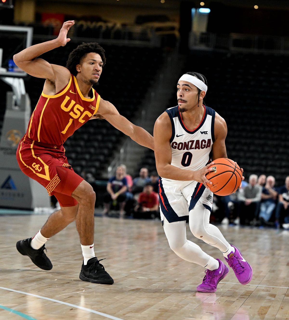 Gonzaga guard Ryan Nembhard (0) dribbles the ball as USC guard Desmond Claude (1) defends during a college exhibition basketball game, Sat. Oct. 26, 2024, at the Acrisure Arena in Palm Desert. (Colin Mulvany / The Spokesman-Review)