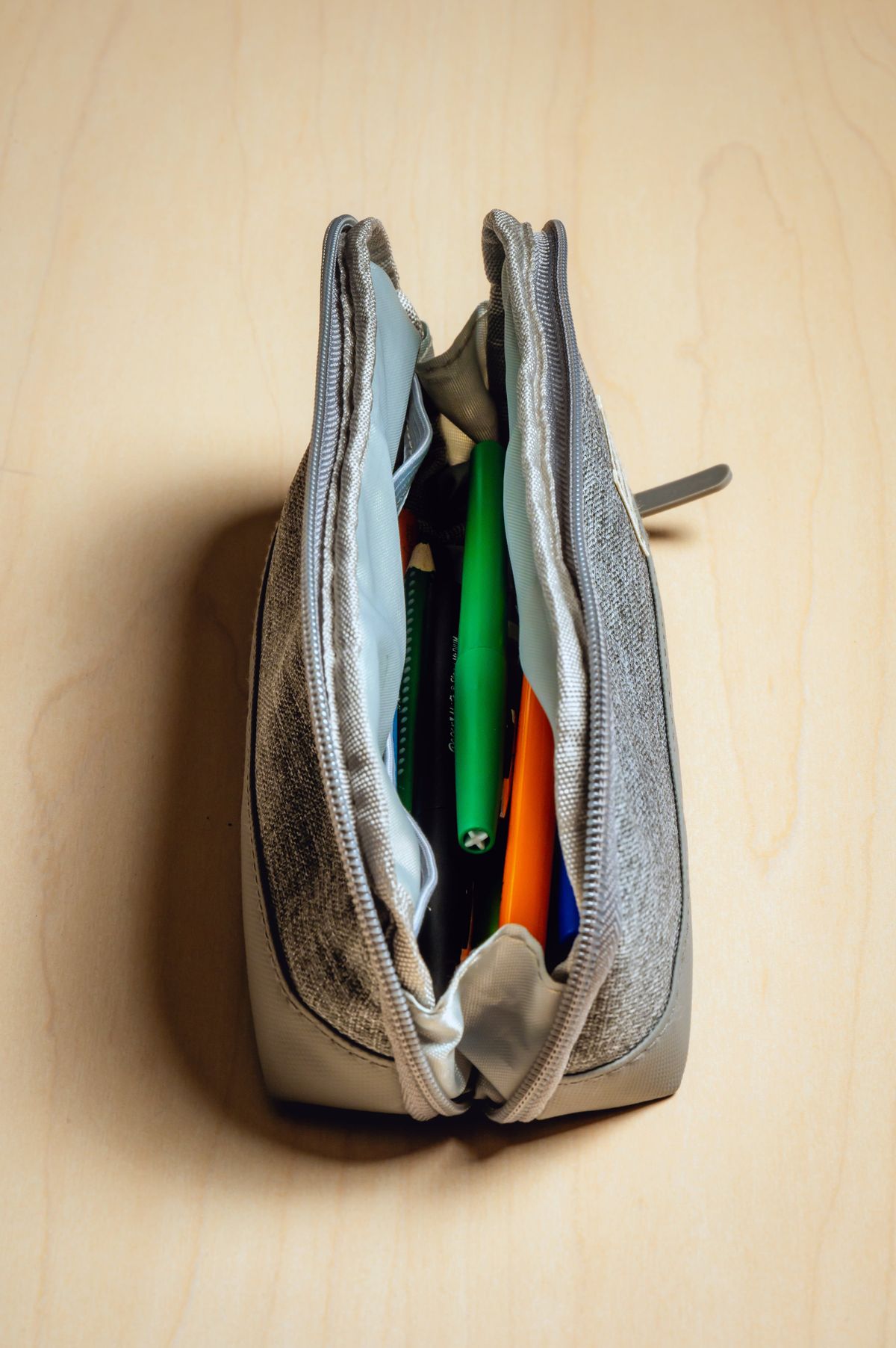 FILE -- A pouch containing colored pencils, pens and markers at the National Weather Service