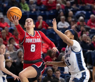 Gonzaga guard Ines Bettencourt (8) lays the ball up as San Diego guard Jayden Rhodes (19) defends during the second half of a NCAA college basketball game, Thursday, Jan. 30, 2025, in the McCarthey Athletic Center.  (COLIN MULVANY)