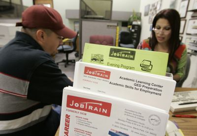 A counselor talks with a man about training programs at JobTrain, a nonprofit vocational training and job placement center in Menlo Park, Calif. (Associated Press / The Spokesman-Review)
