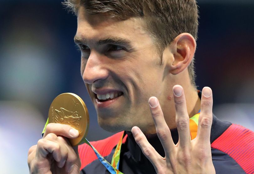 United States’ Michael Phelps celebrates winning the gold medal in the 200-meter individual medley for the fourth straight Olympics. (Lee Jin-man / Associated Press)