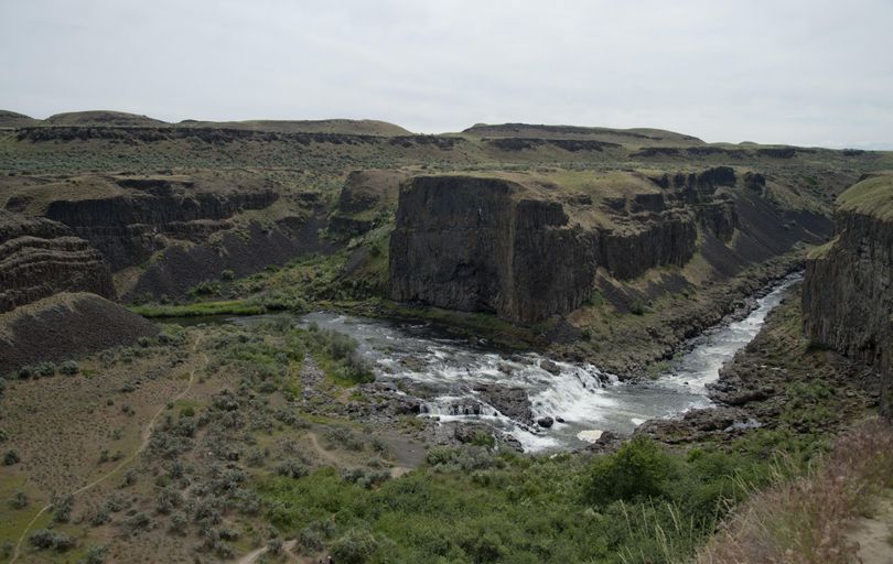 Visitors to Palouse Falls, in southeastern Washington near Washtucna, can hike around to a stretch of the Palouse River above the falls and see spectacular vertical walls of rock that line the river gorge in places. (Jesse Tinsley / The Spokesman-Review)
