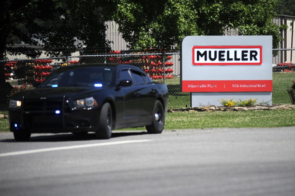 A police car guards the entrance to a Mueller Co. fire hydrant plant where police said multiple people were shot to death and others were wounded in Albertville, Ala., on Tuesday, June 15, 2021. (Jay Reeves)
