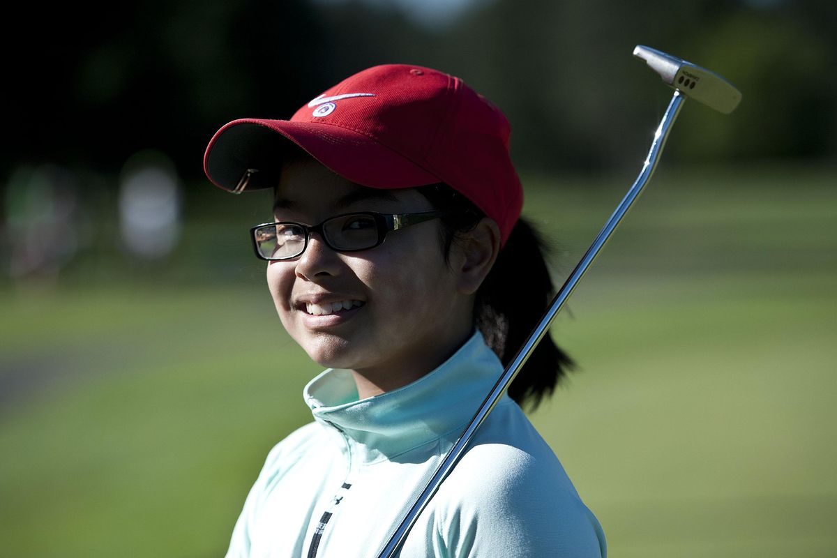 Amanda Nguyen, 9, works on her golf game at Avondale Golf Course in Hayden on Tuesday. (Kathy Plonka / The Spokesman-Review)