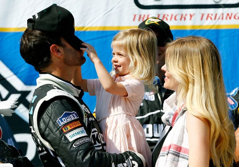 Jimmie Johnson, driver of the #48 Lowe's/Kobalt Tools Chevrolet, celebrates in Victory Lane with his wife Chandra and daughter Genevieve Marie after winning the NASCAR Sprint Cup Series Party in the Poconos 400 at Pocono Raceway on June 9, 2013 in Long Pond, Pennsylvania. (Photo Credit: Jared Wickerham/Getty Images) (Jared Wickerham / Getty Images North America)