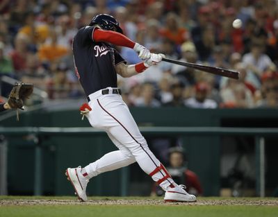 Washington Nationals' Bryce Harper hits an RBI double during the fifth inning of a baseball game against Baltimore Orioles at Nationals Park, Tuesday, June 19, 2018, in Washington. (Carolyn Kaster / AP)