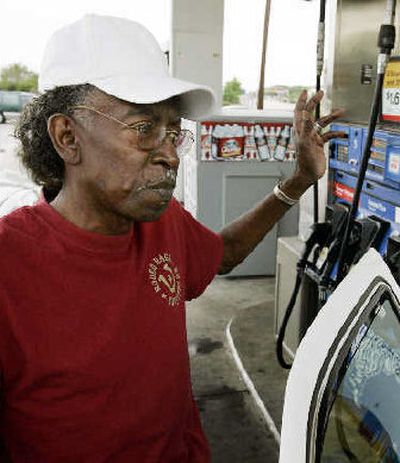 
Willie Webb of Dallas fills up his sedan at a service station in Dallas. Government and industry data show that America's consumption of gasoline is not rising as rapidly as it was this time last year. 
 (Associated Press / The Spokesman-Review)