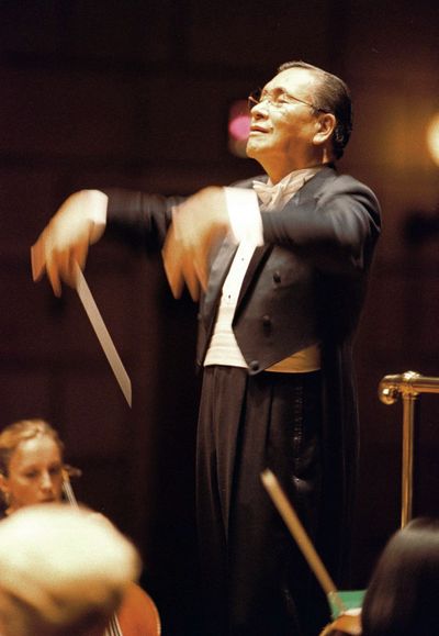 Norio Ohga, chairman and CEO of Sony, conducts an orchestra in Rochester, N.Y., in October 1996. (Associated Press)